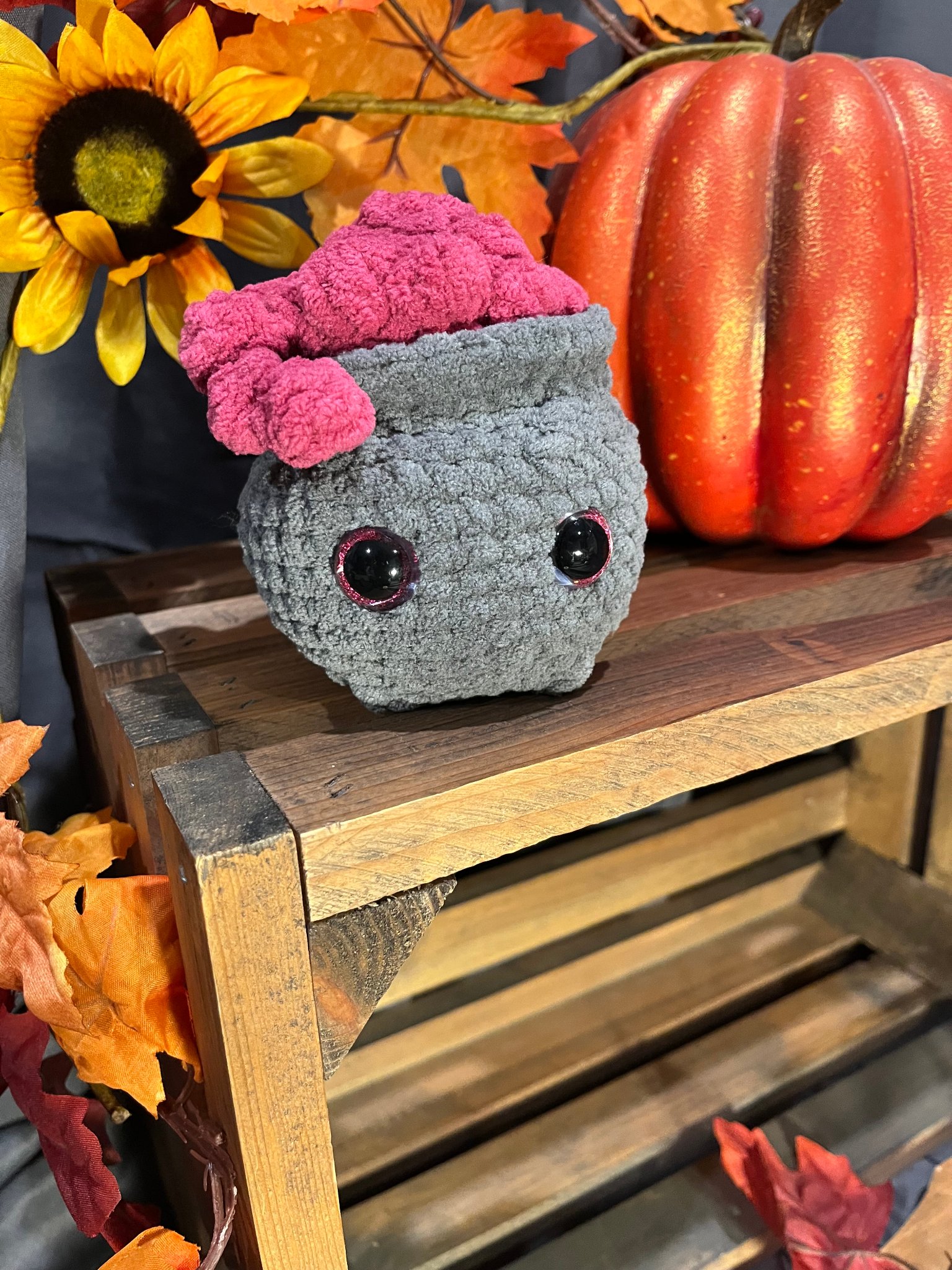Handcrafted crochet cauldron with autumn details